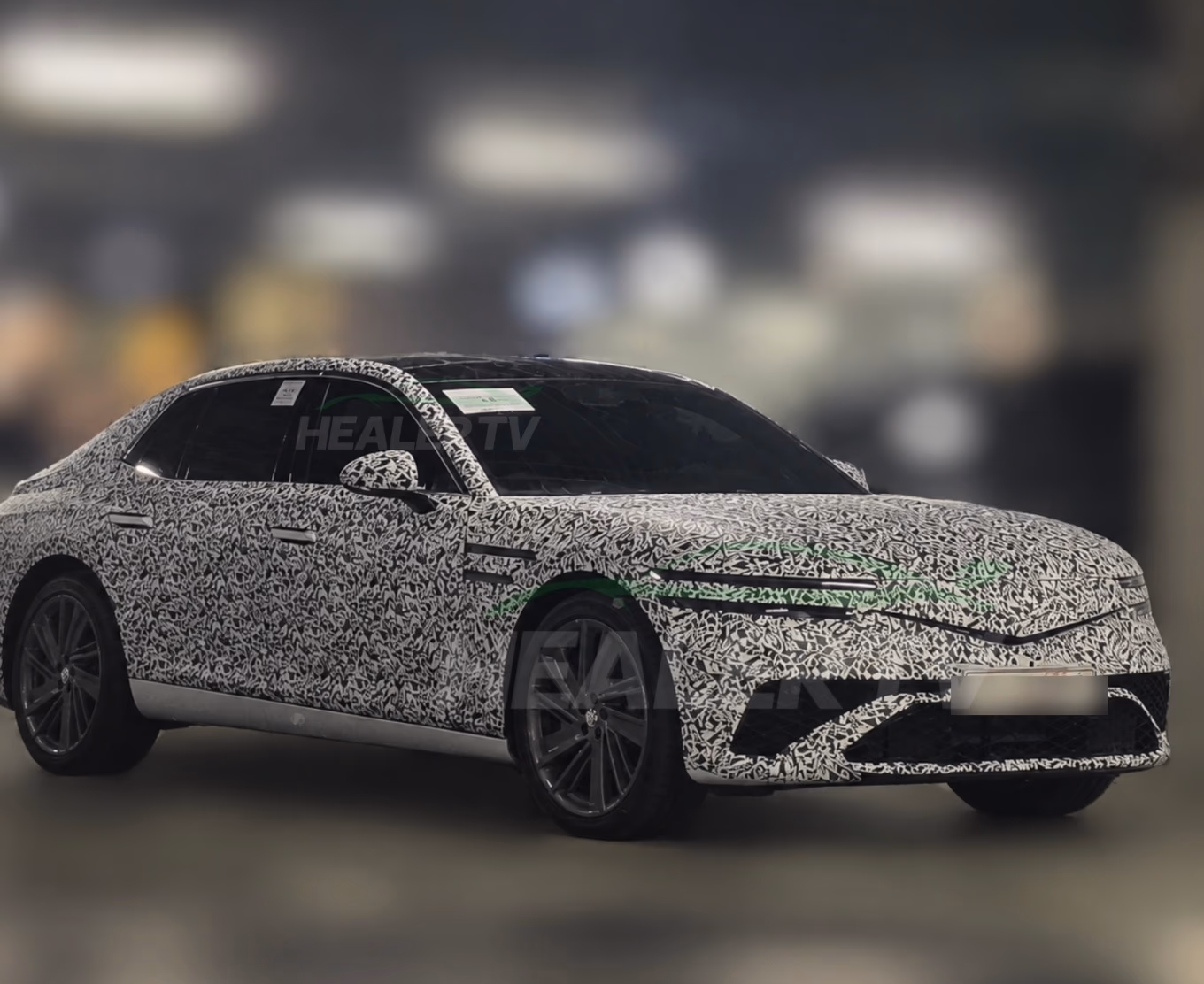 Genesis G90 facelift prototype in light camouflage