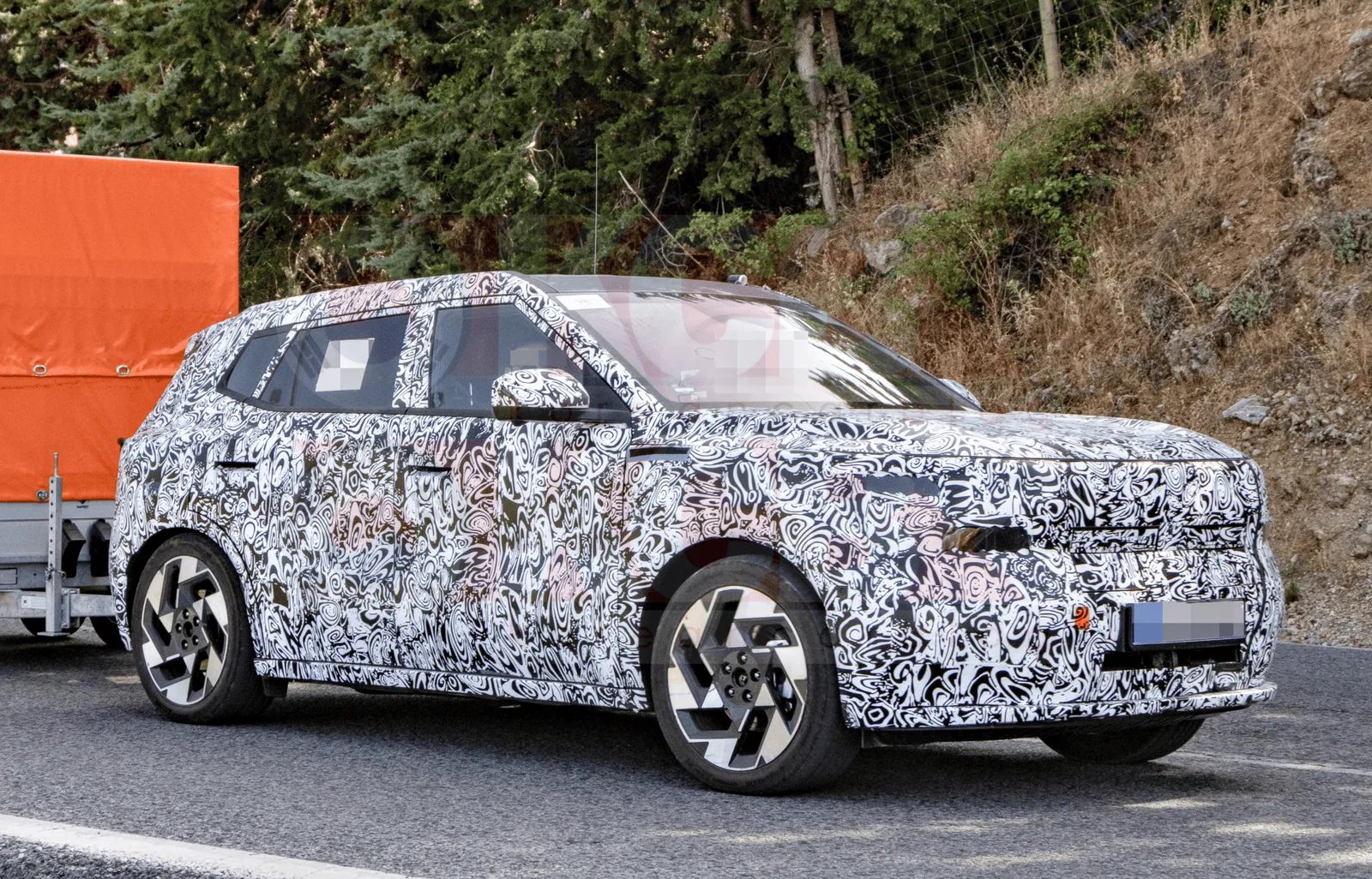 Next-Gen Hyundai Kona (SX3) Spied Shedding Camouflage in Spain: Hybrid Power, E-AWD, and Pleos Connect Revealed